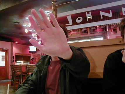 Todd not wanting his photo taken :)<br>Location: Johnny Garlic's